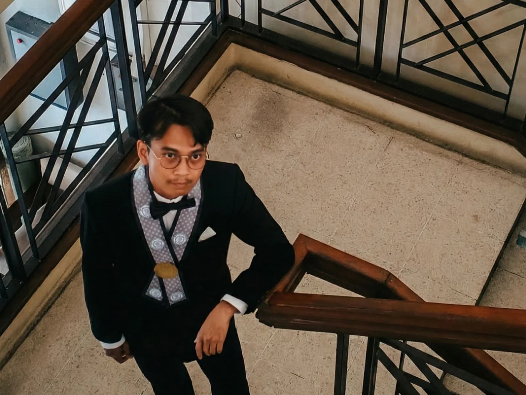 Portrait of the portfolio owner on a staircase.